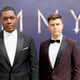 Hosts Michael Che and Colin Jost, who aren’t UNhappy to be there